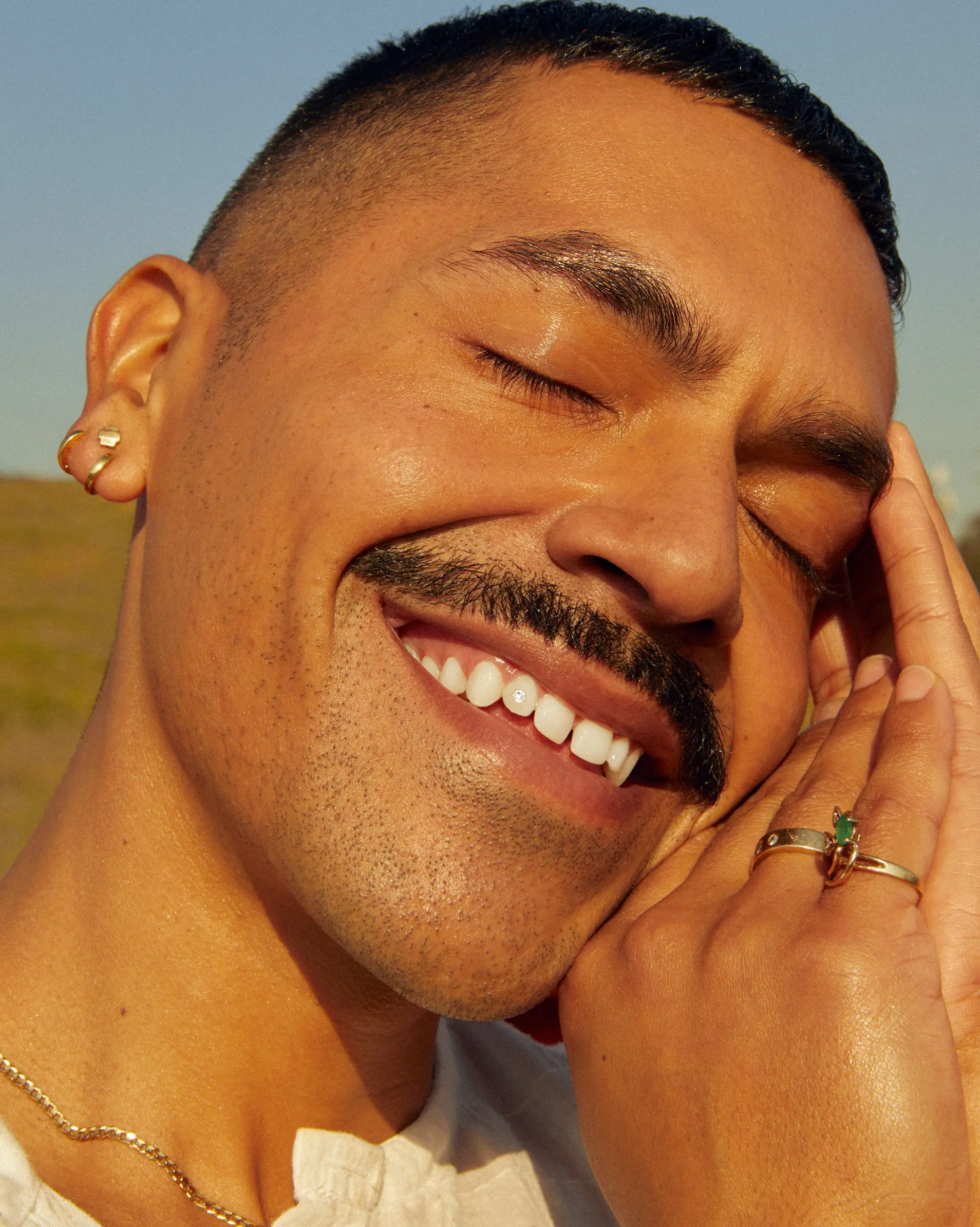 A Grow Therapy client smiling, eyes closed
