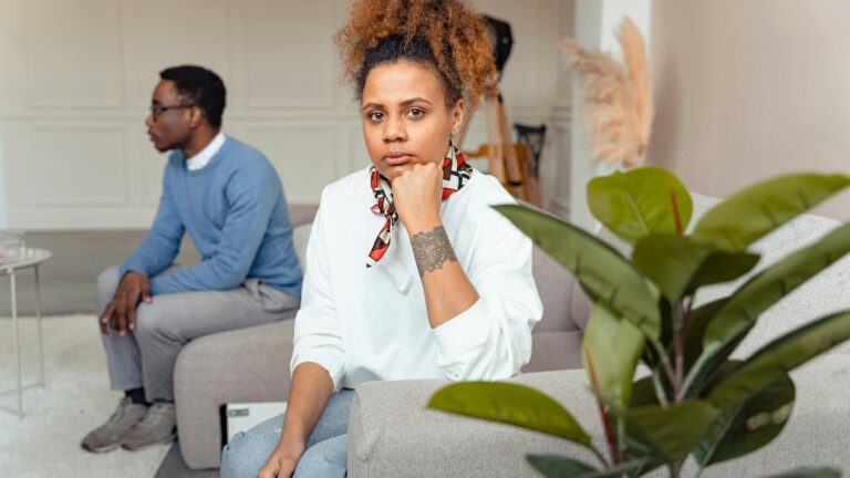 Man speaks to woman in therapy.