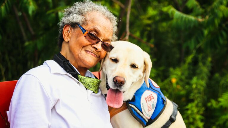Elderly woman with therapy dog.