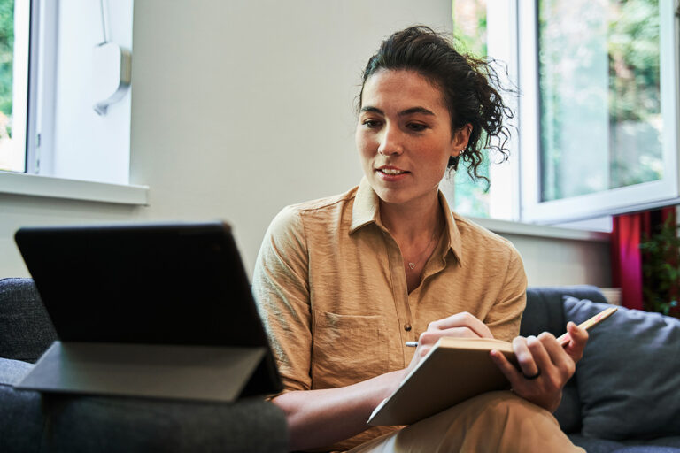 A patient speaks with a psychiatrist using their tablet.