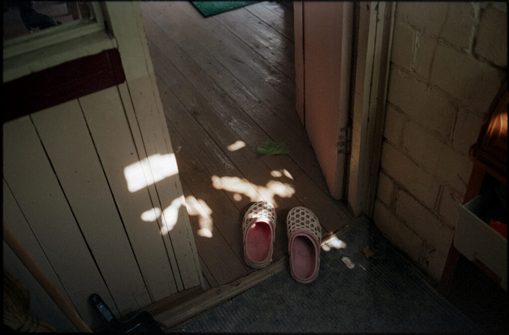 Photo of slippers in the doorway of a vacation home